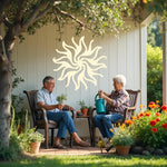 Twilight Radiance metal wall art in Canola Cream, with a warm yellowish tone and intricate sunburst design, offering a charming accent to patios and interiors.