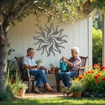 Twilight Radiance metal wall art in Berry Grey Gloss, combining a sophisticated grey finish with a dynamic swirling sun design for modern decor.