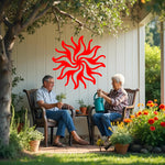 Twilight Radiance metal wall art in Signal Red, featuring a vibrant sunburst motif that adds energy and a pop of color to any living or garden space.