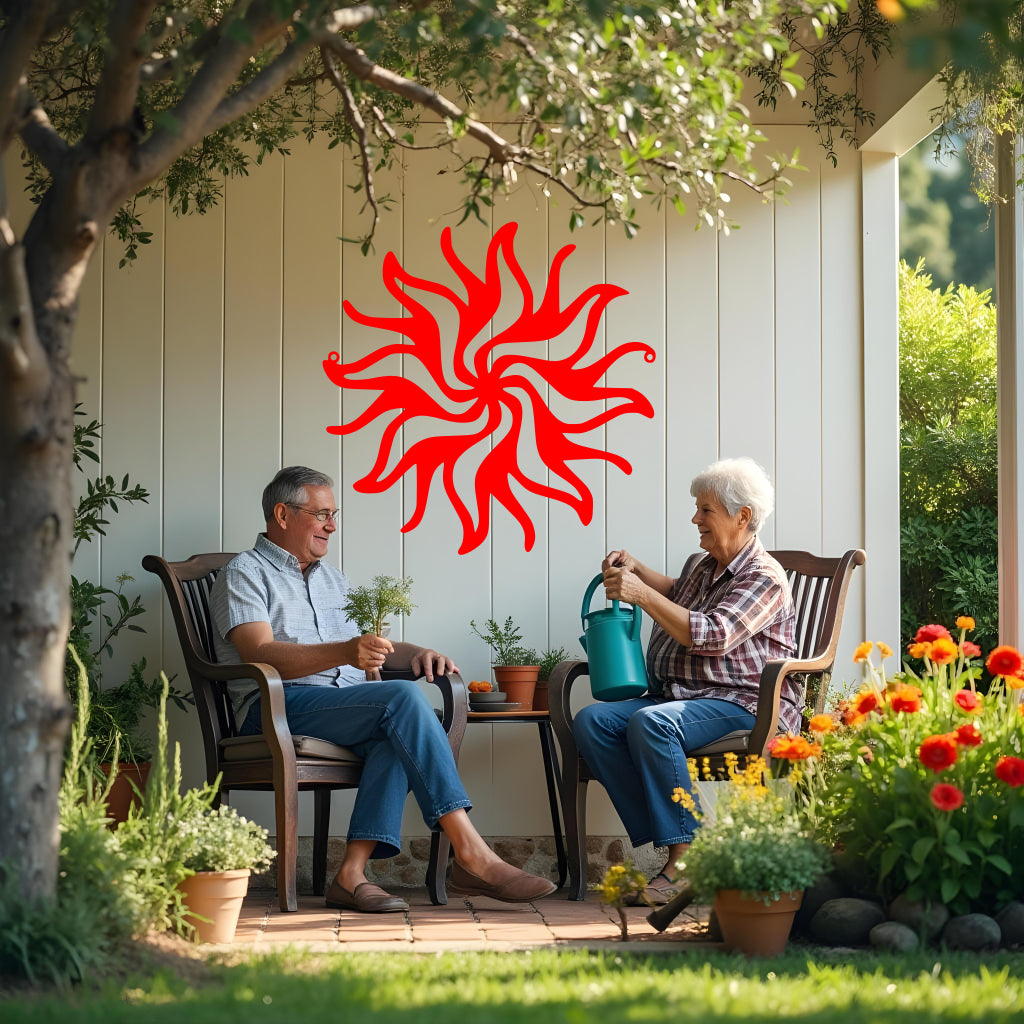 Twilight Radiance metal wall art in Signal Red, featuring a vibrant sunburst motif that adds energy and a pop of color to any living or garden space.